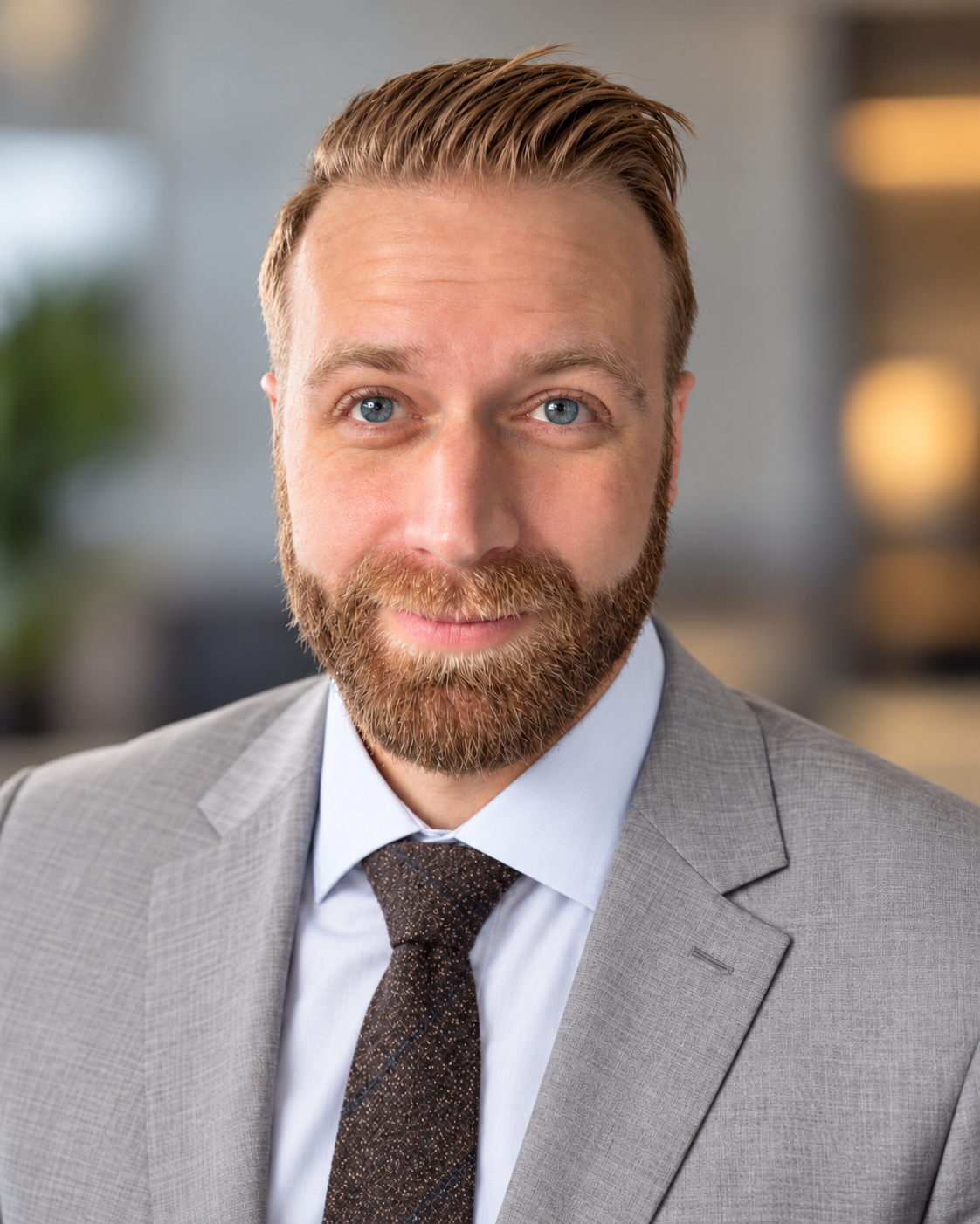 Matthew Fugett wearing a light gray suit